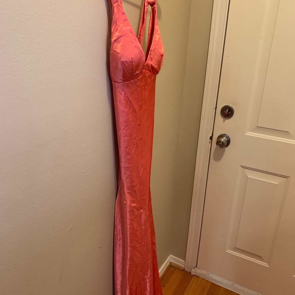 A peach criss cross prom dress